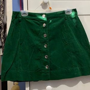 green mini skirt.
